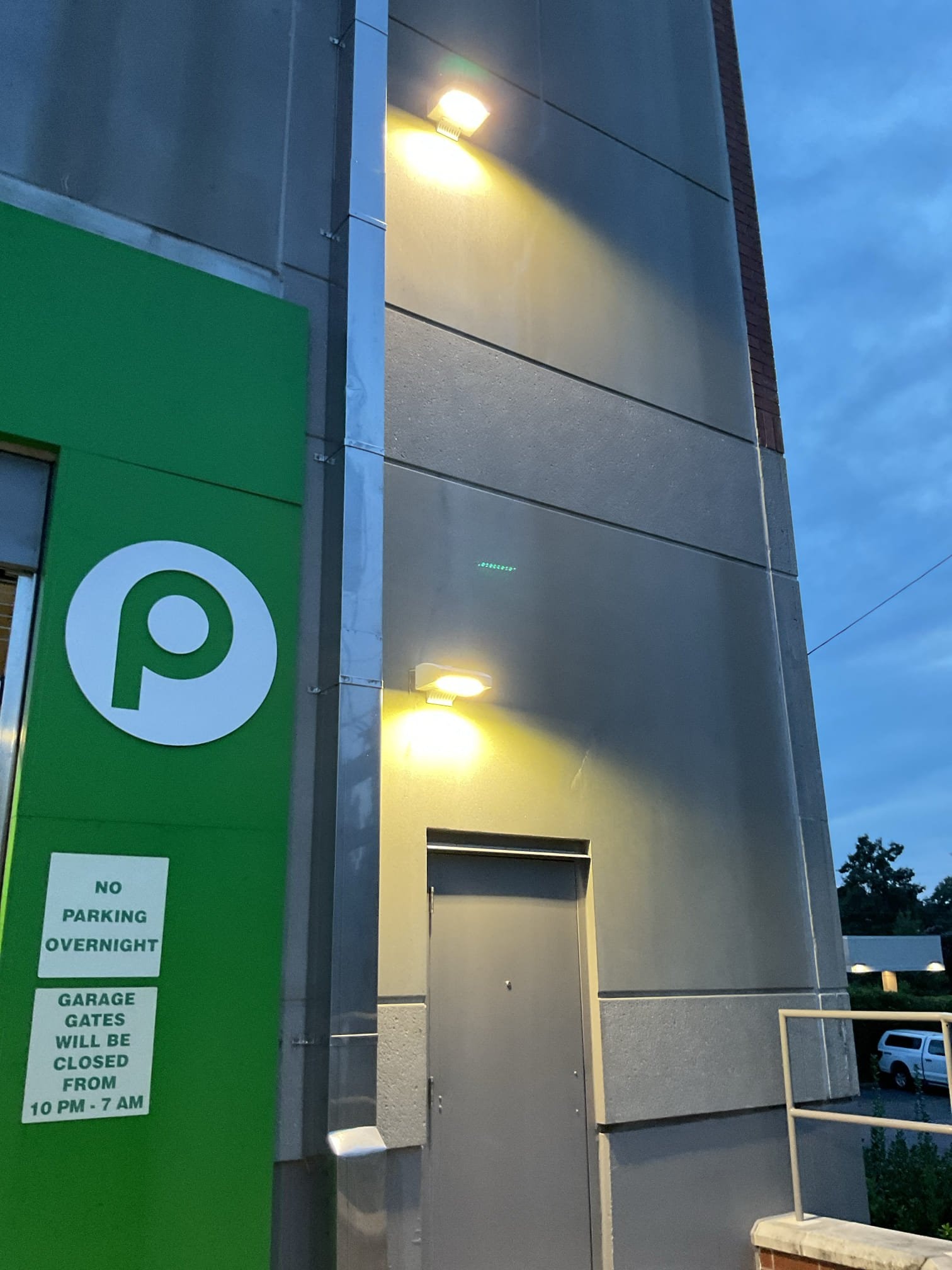 Charlotte Exterior LED Wall Light Installation: Parking & Breezeway completed by Touchstone Electric