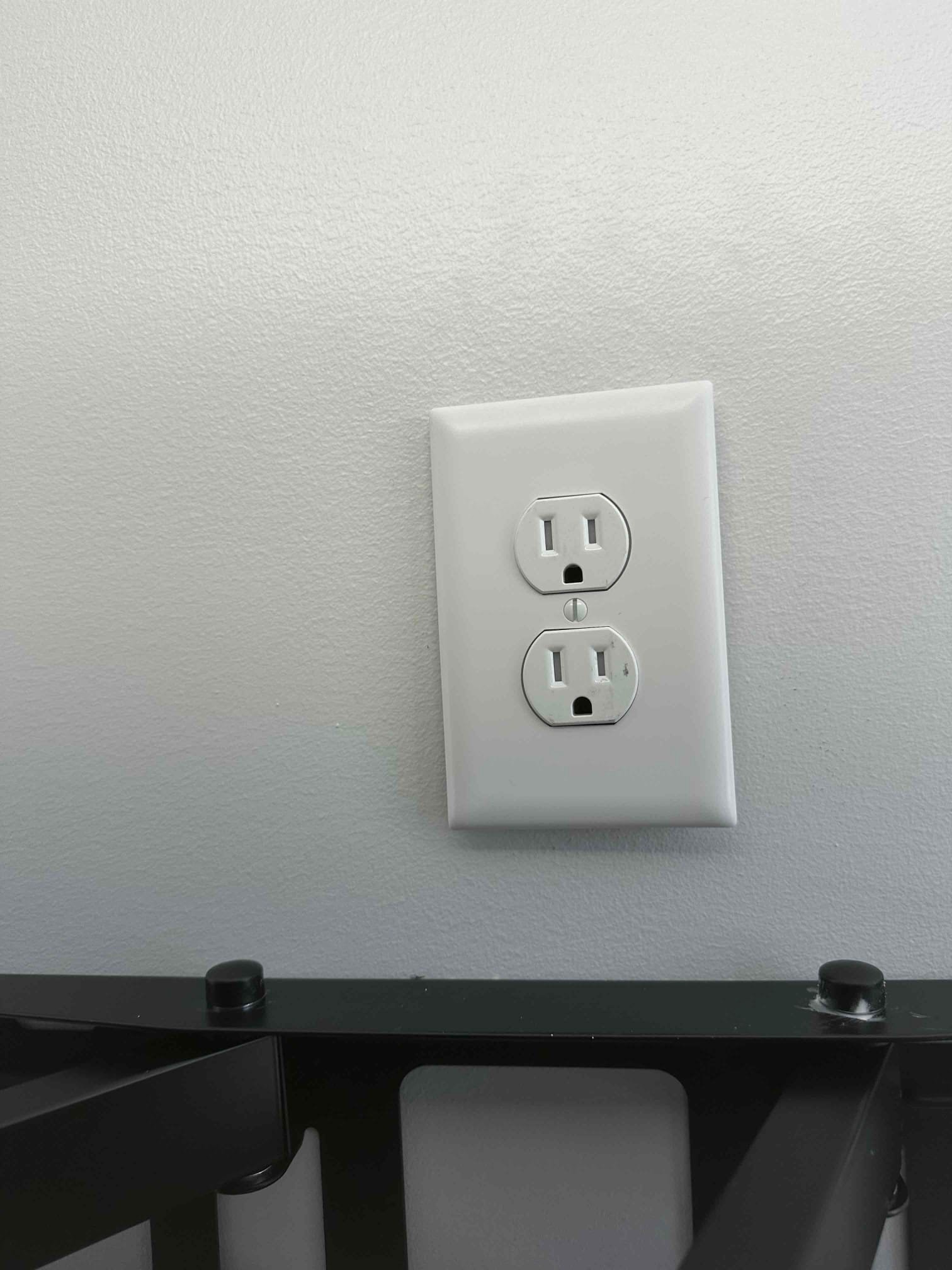 Outlet Installation Behind Wall-Mounted TV in Charlotte, NC completed by Touchstone Electric