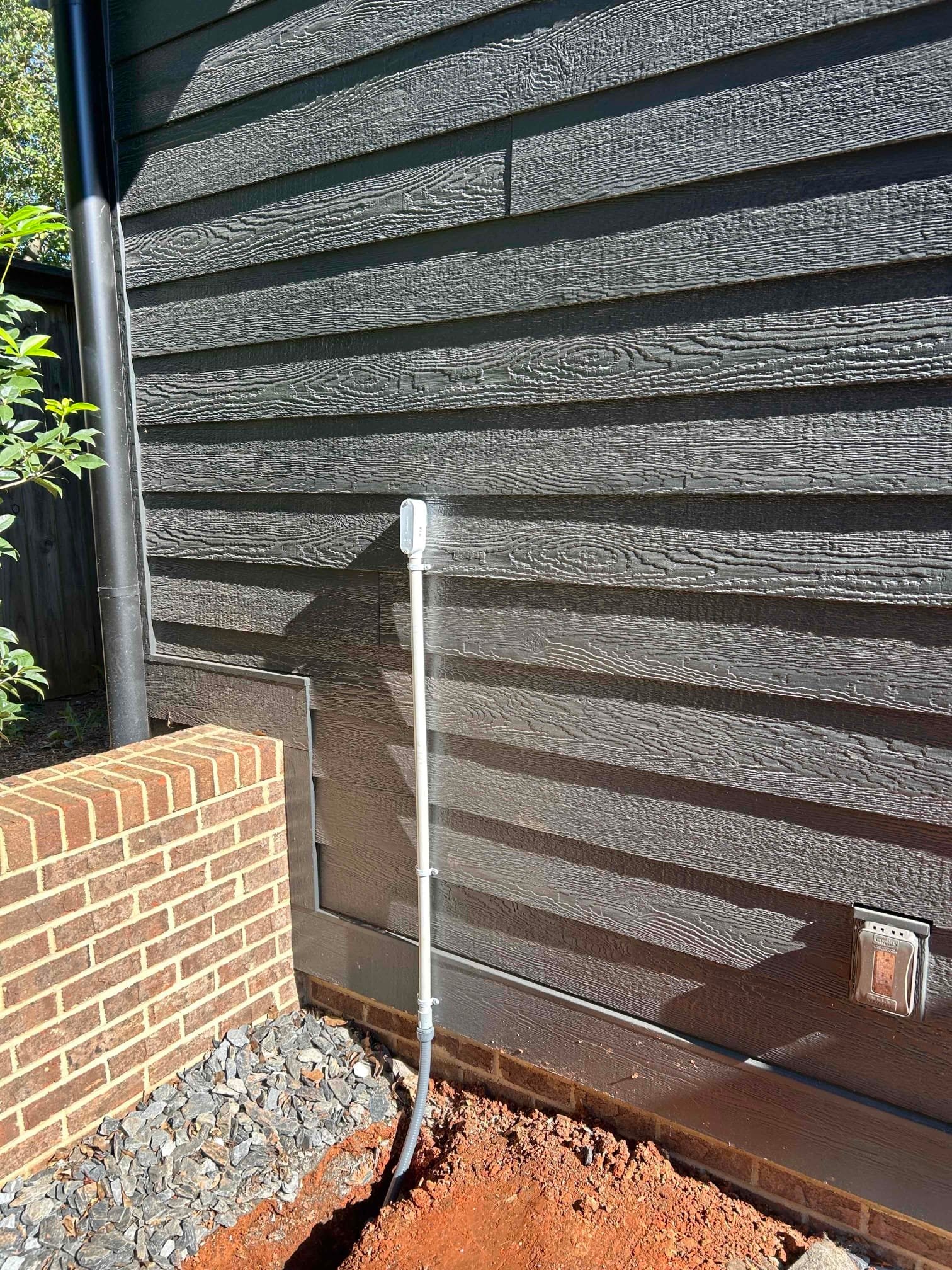 Tesla EV Charger Installation with Garage Trenching in Greenville completed by Touchstone Electric