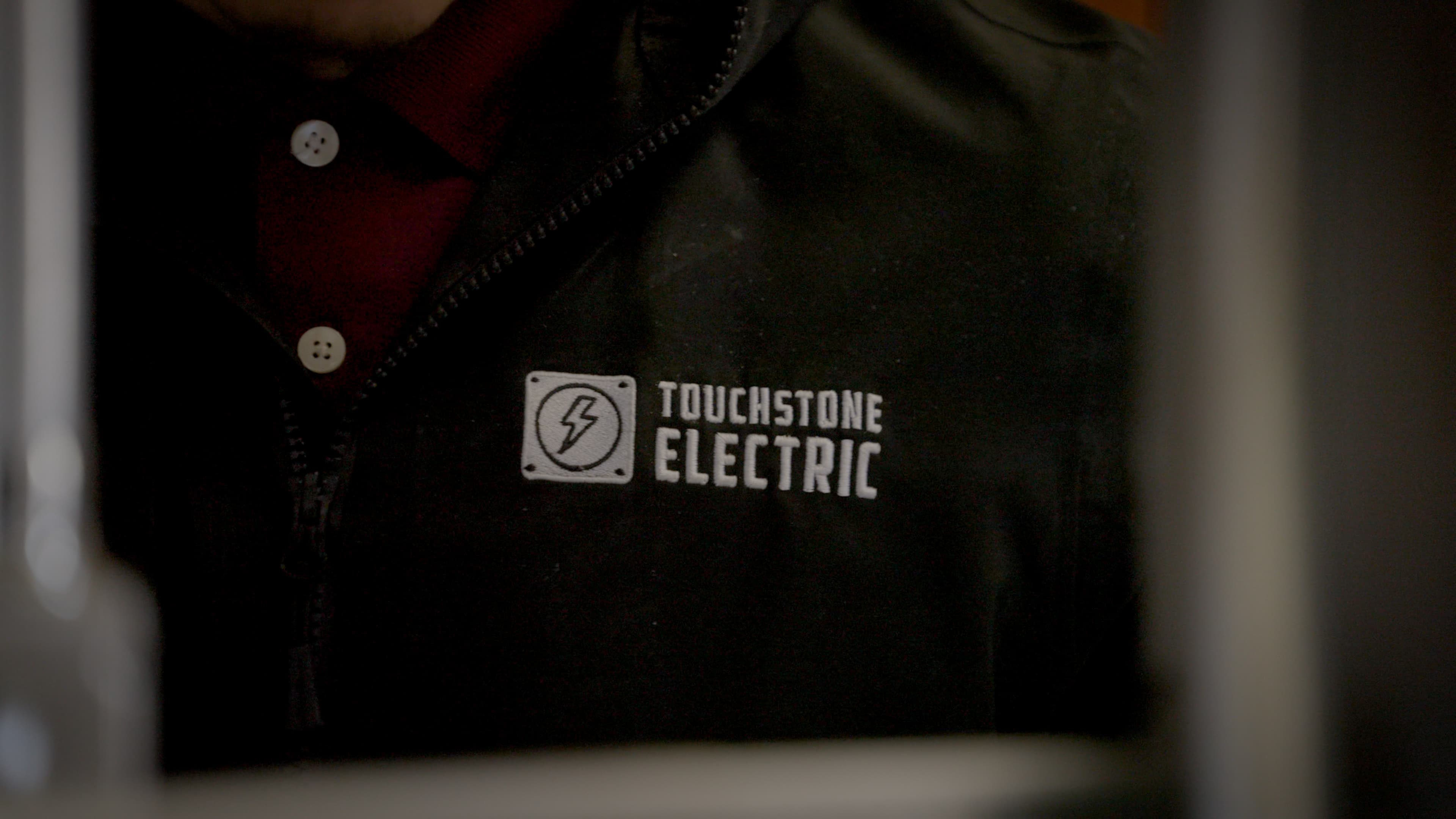 Touchstone Electric reviewing commercial electrical plans on a job site