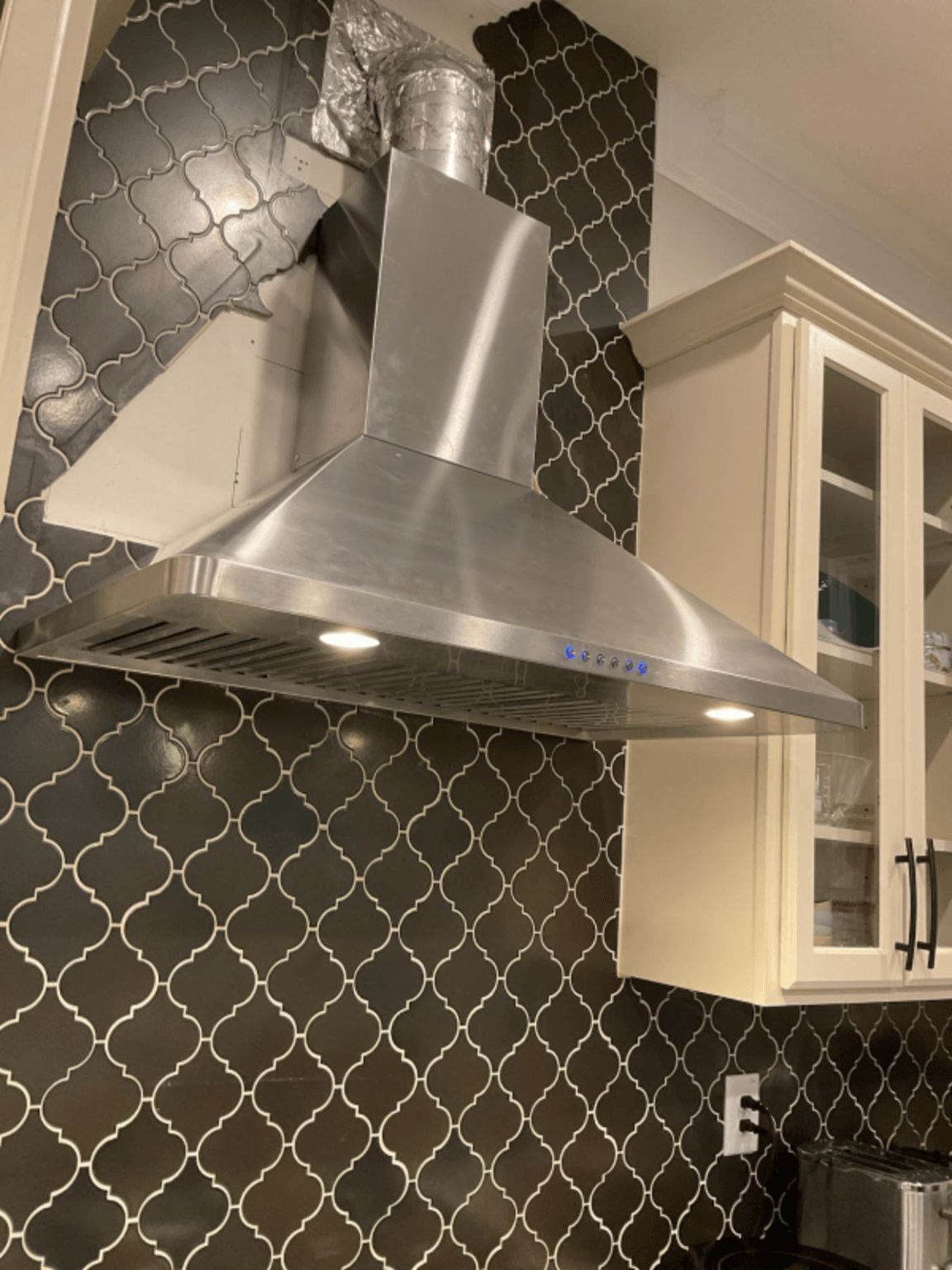 Installed range hood and kitchen appliance electrical connection