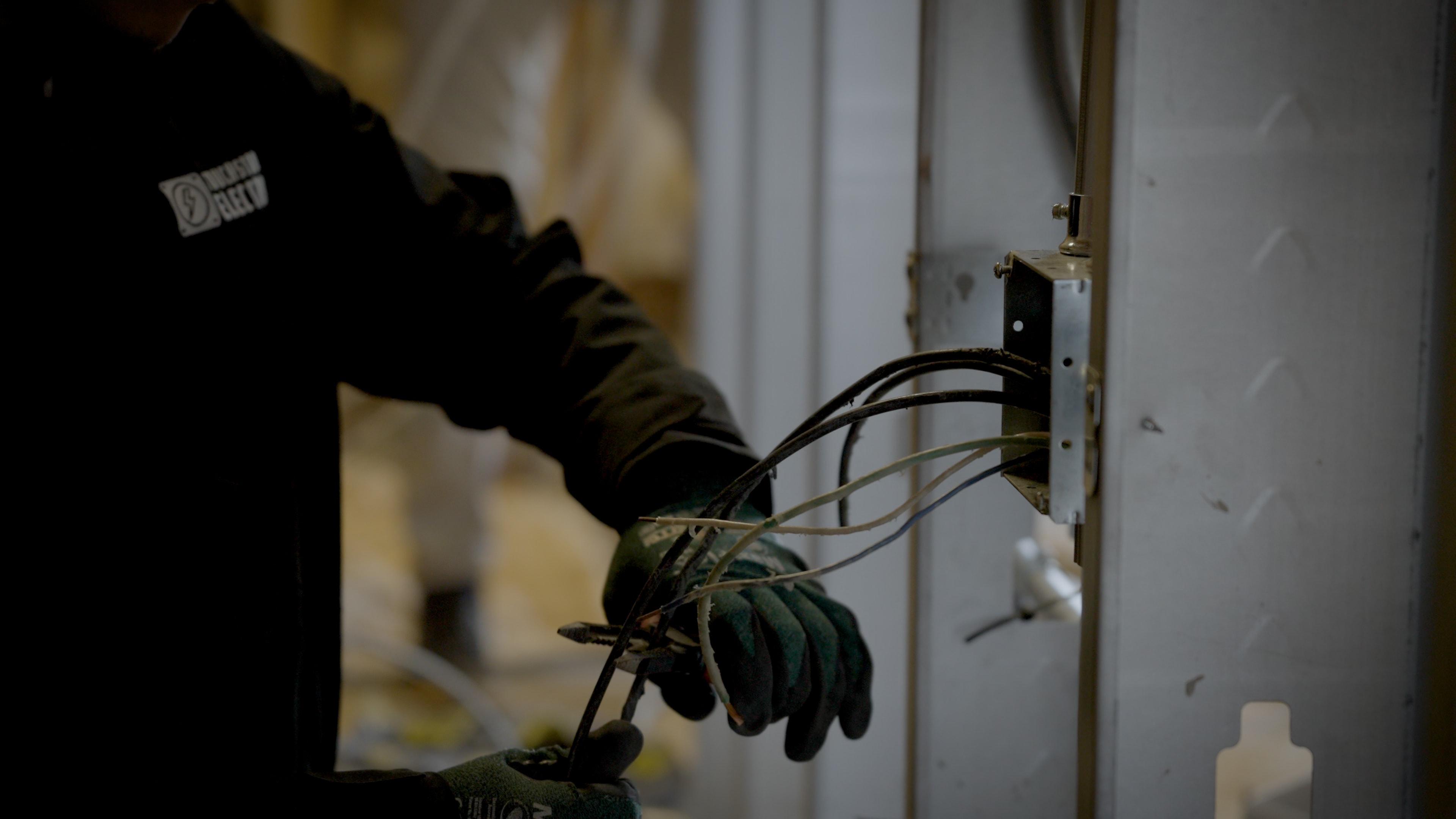 Touchstone Electric electrician focused on wire installation for a Dentsville project