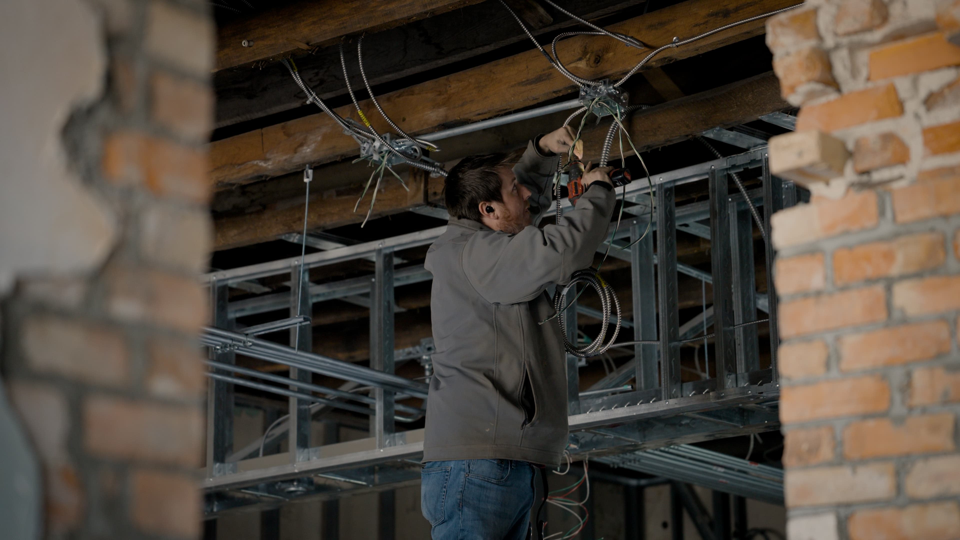 Electrician testing completed commercial electrical work
