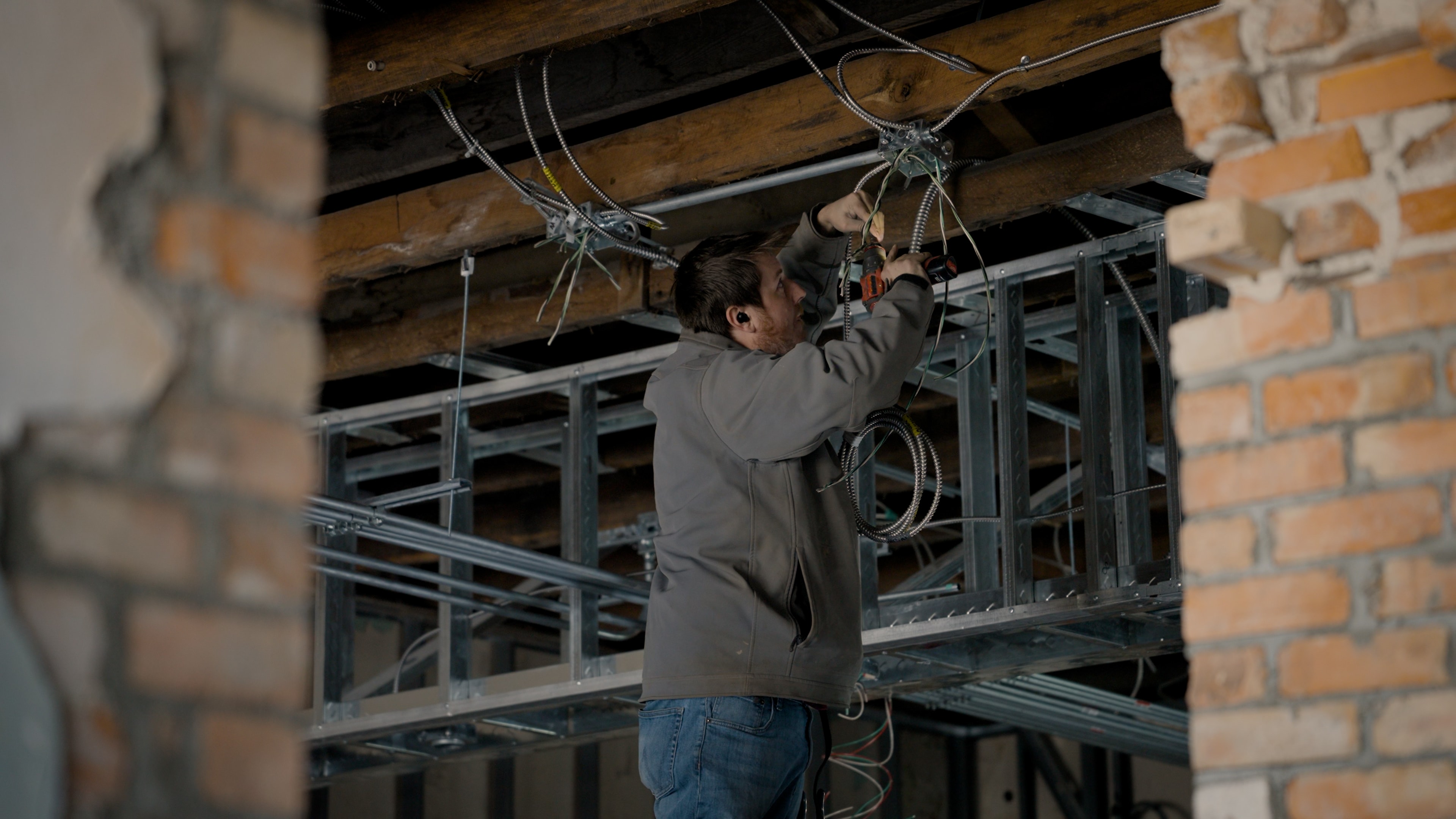 Electrician inspecting commercial electrical work
