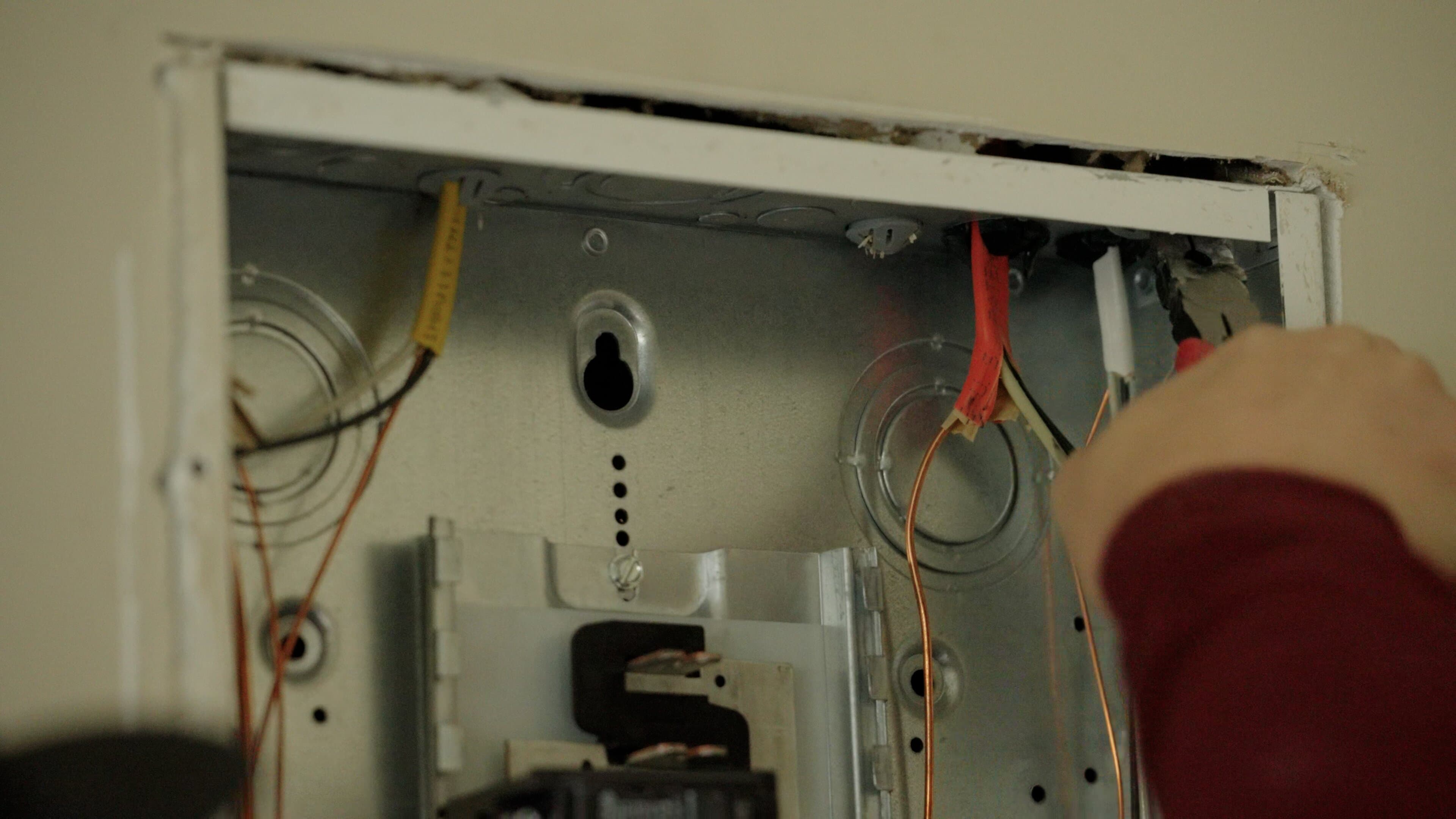 Touchstone Electric technician installing an EV charger