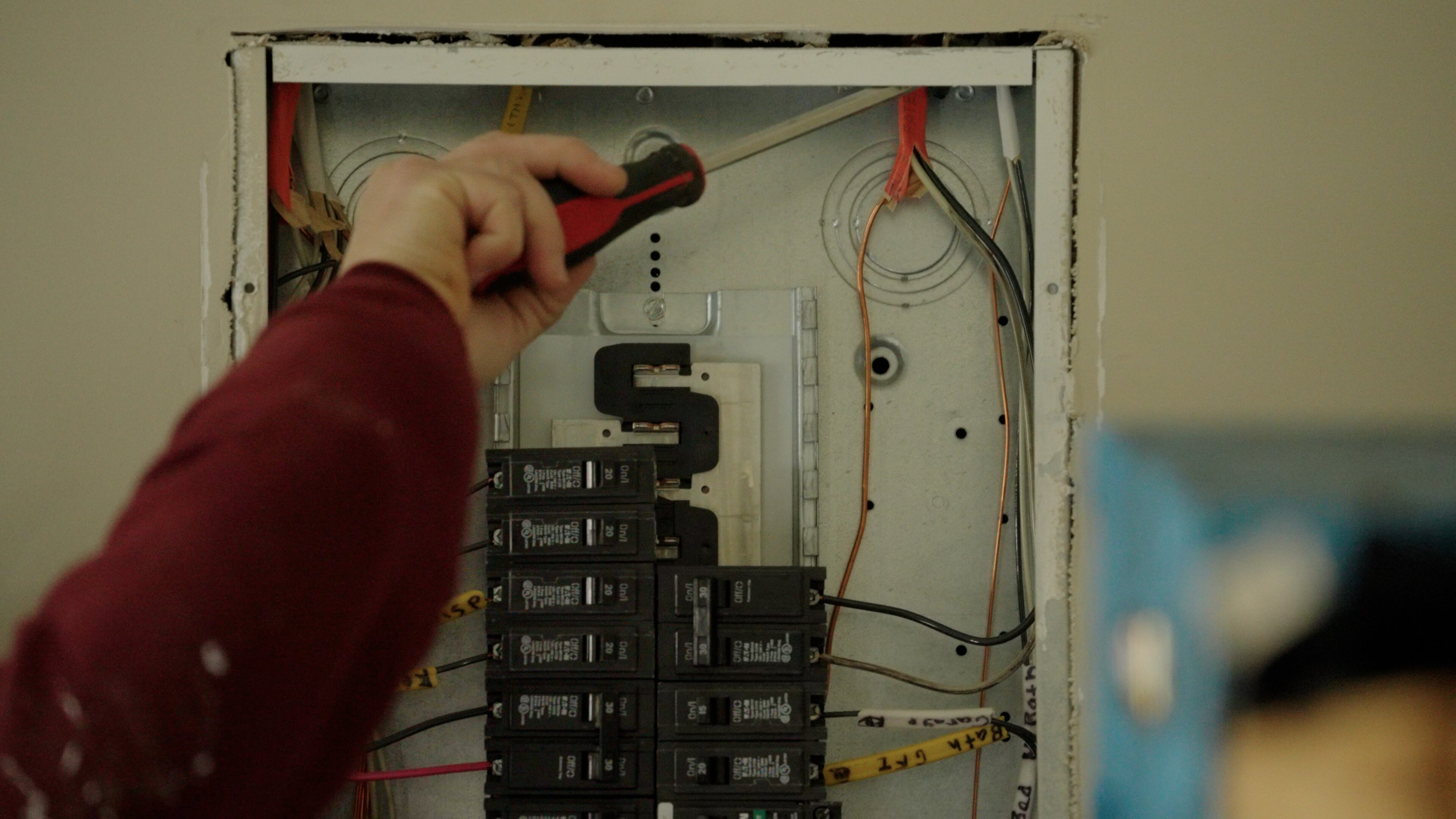 Touchstone Electric technician installing an EV charger