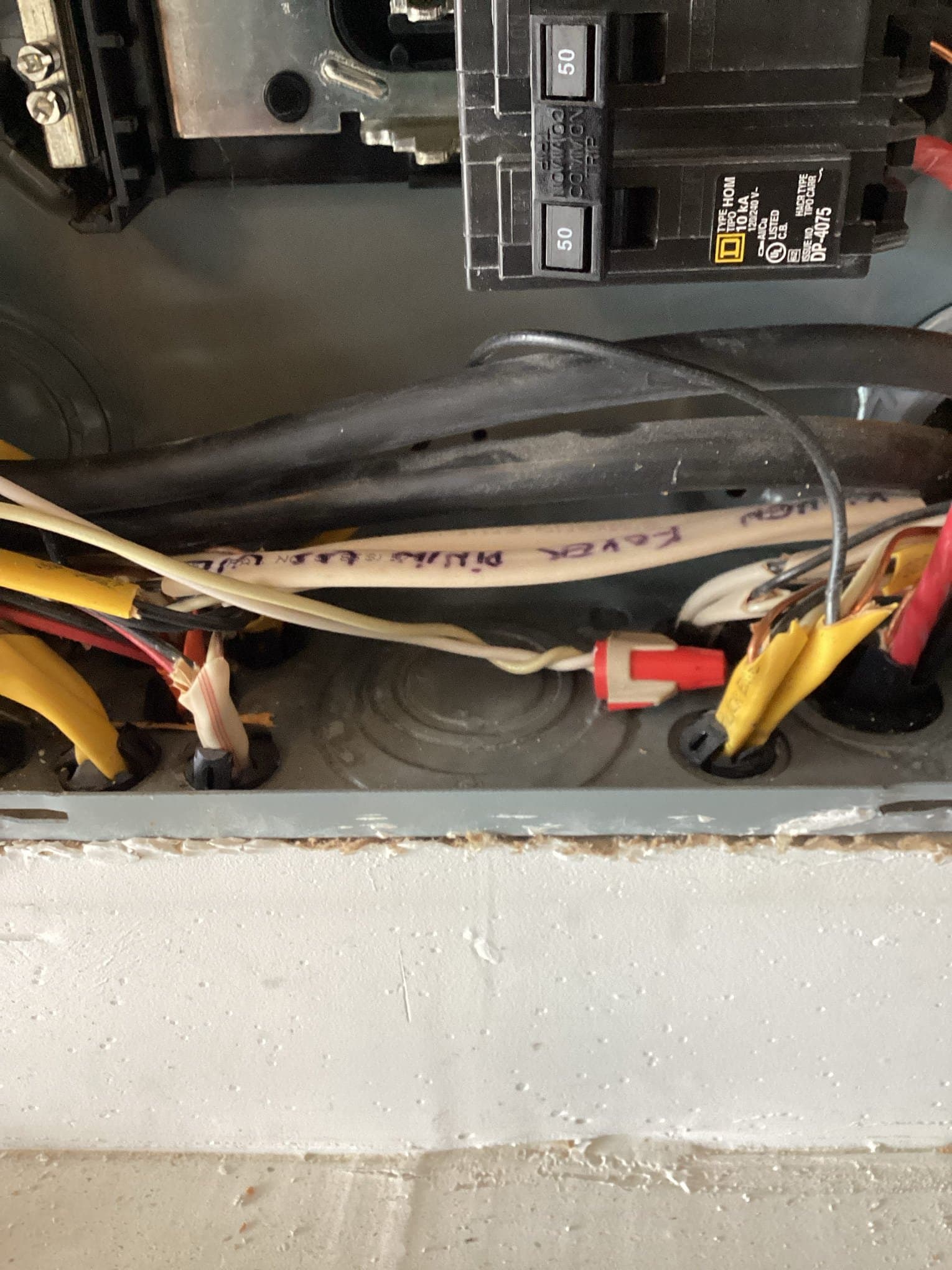 Electrician assessing electrical needs for ev charging station installation