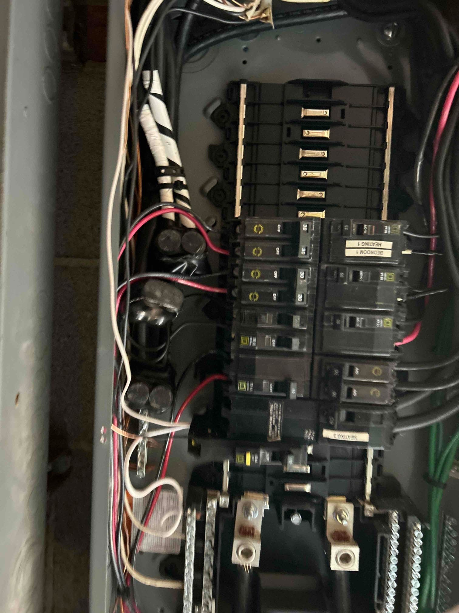 Electrician assessing electrical needs for level 2 ev charger installation