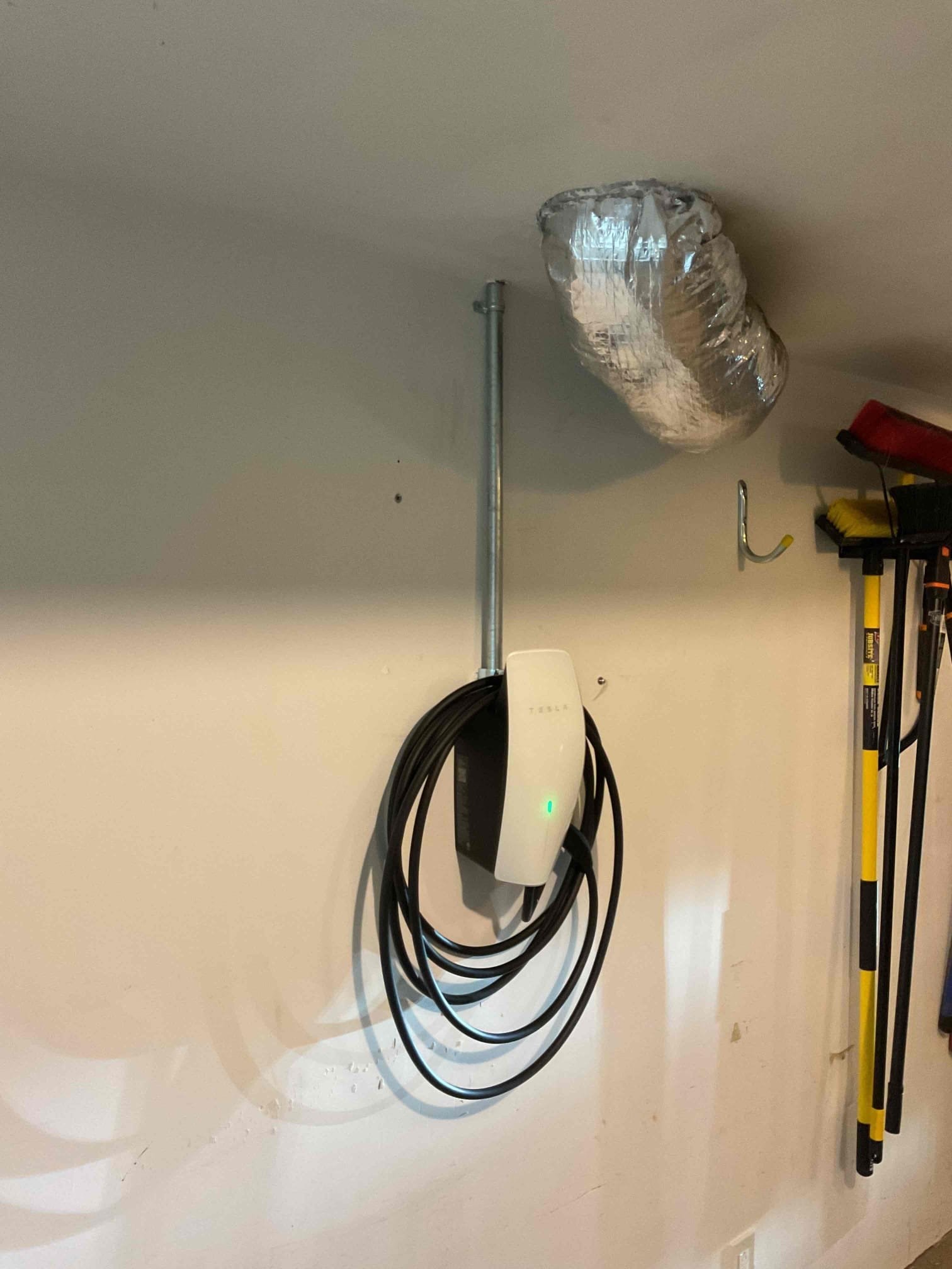 Electrician assessing electrical needs for level 2 ev charger installation