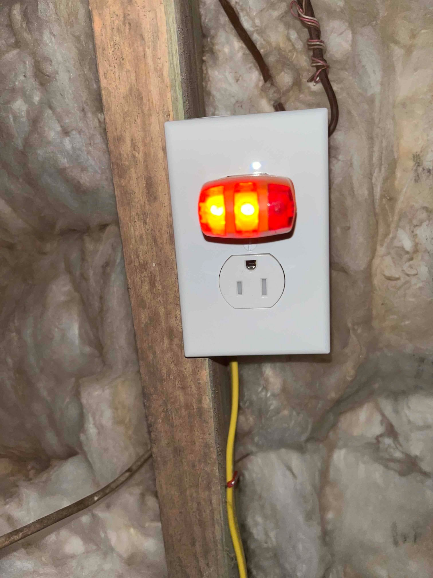 Electrician assessing outlets and switches in a home