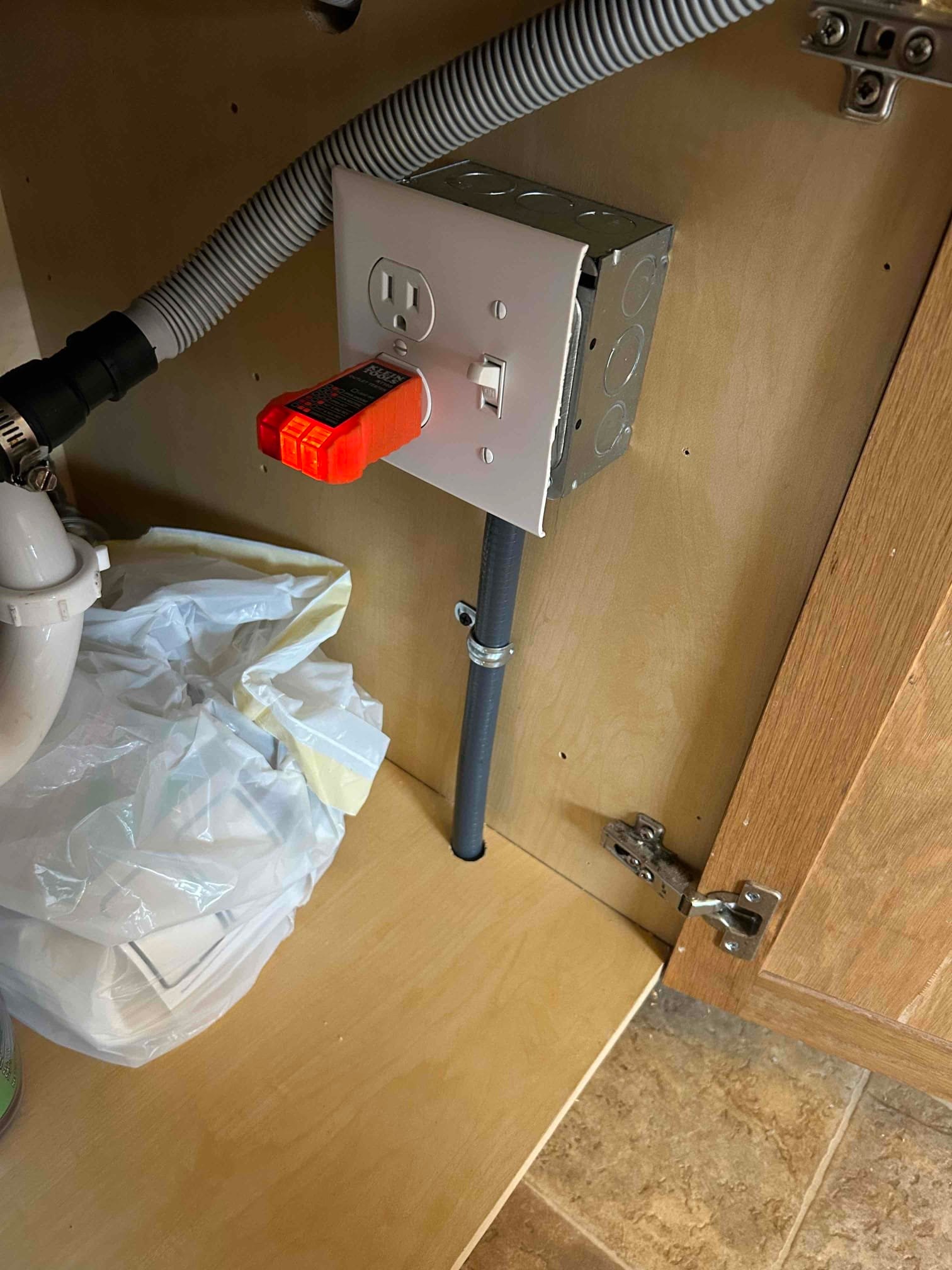 Touchstone Electric technician upgrading outlets and switches