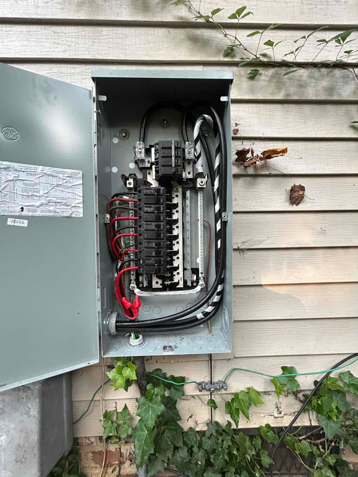 Electrician assessing electrical needs for meter base & service replacement