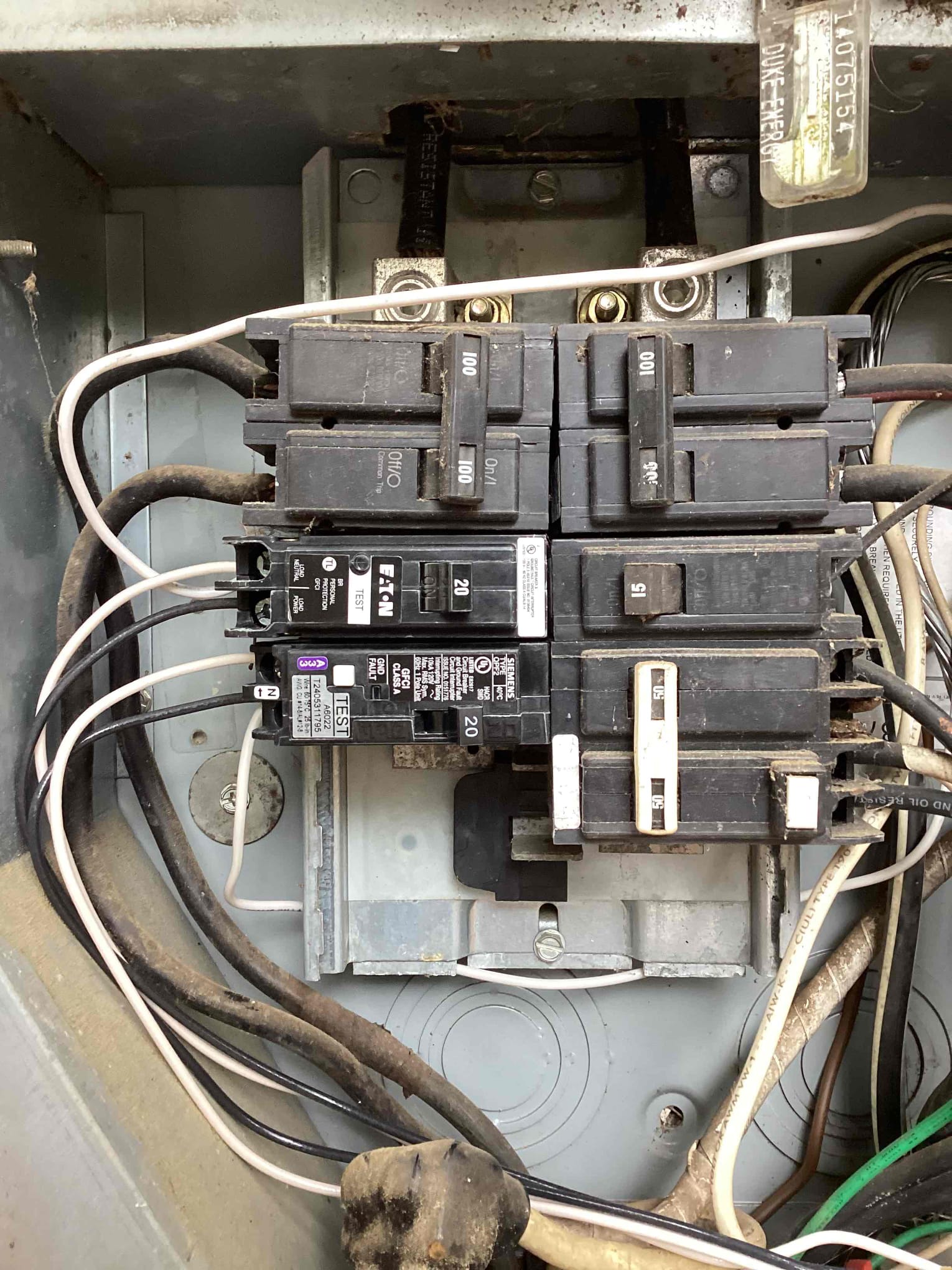 Touchstone Electric technician working on an electrical panel