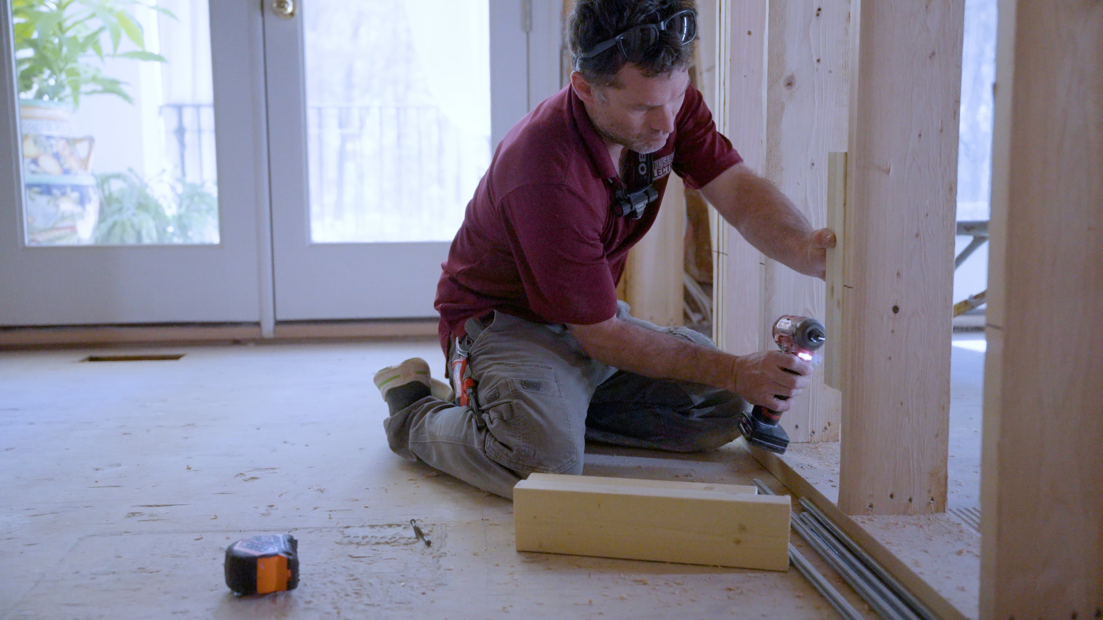 Electrician testing completed whole-house surge protection work