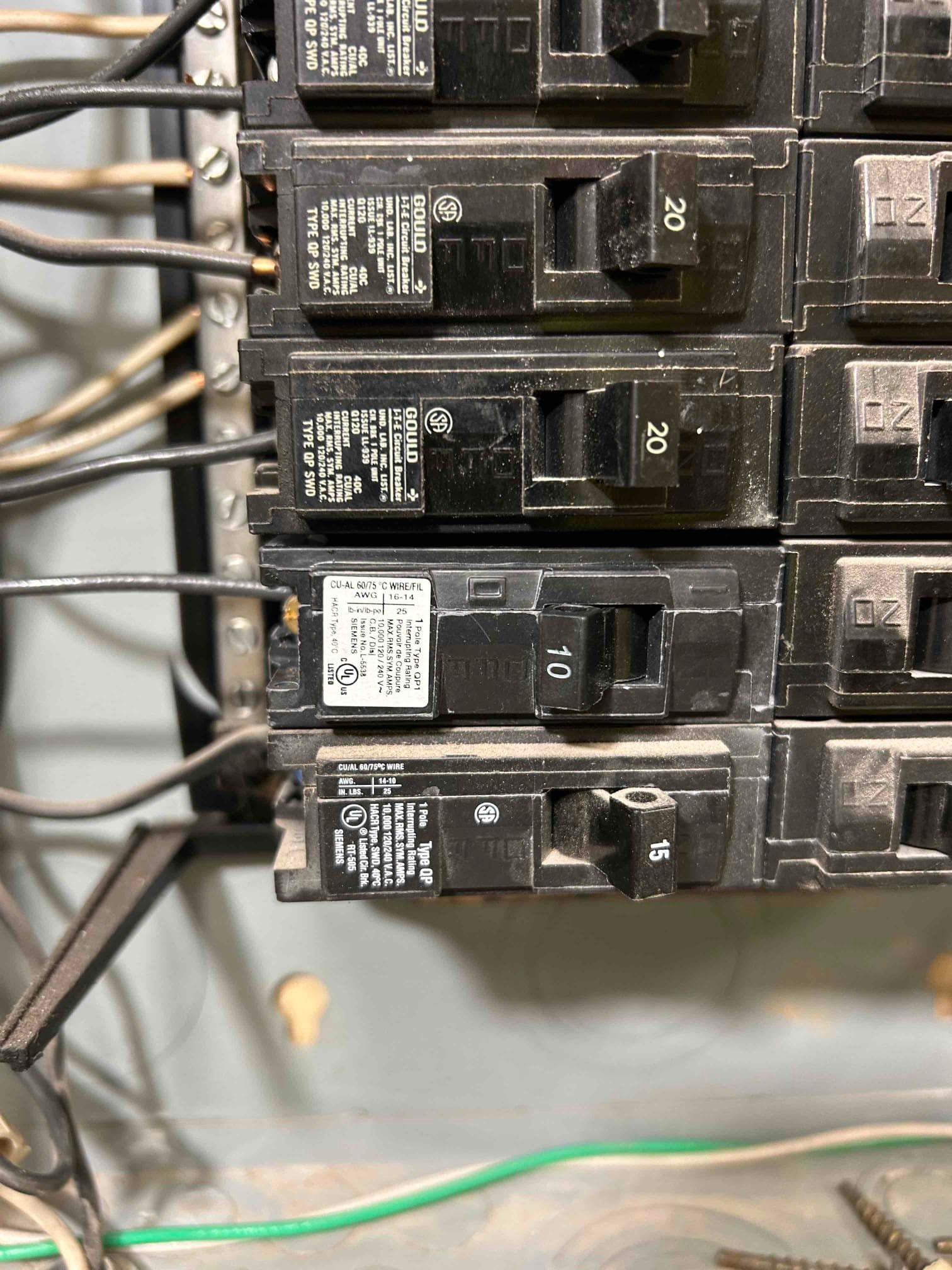 Electrician assessing electrical needs for whole-house surge protection