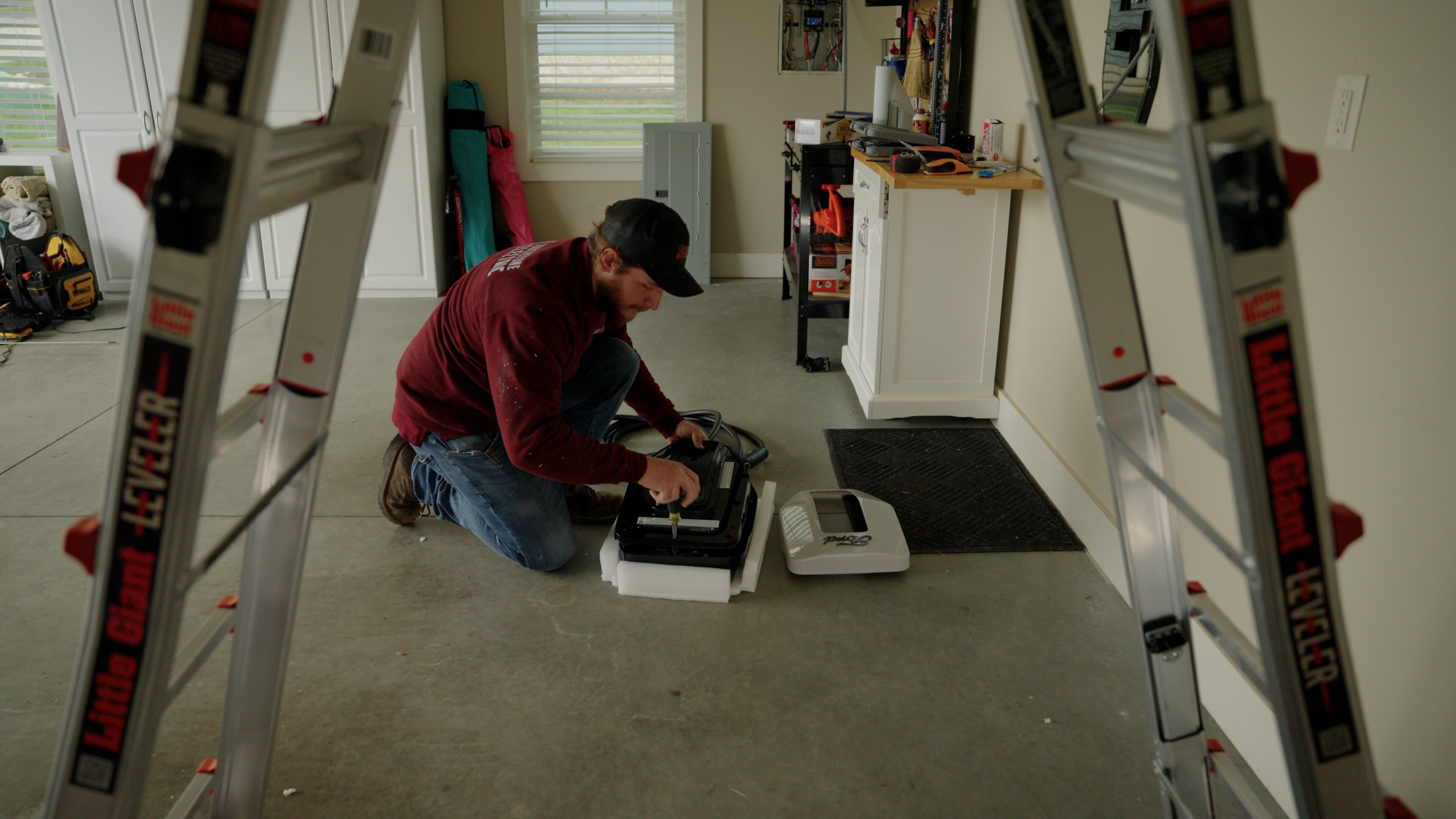 Touchstone Electric electrician reviewing outdoor electrical service equipment for pool electrical work