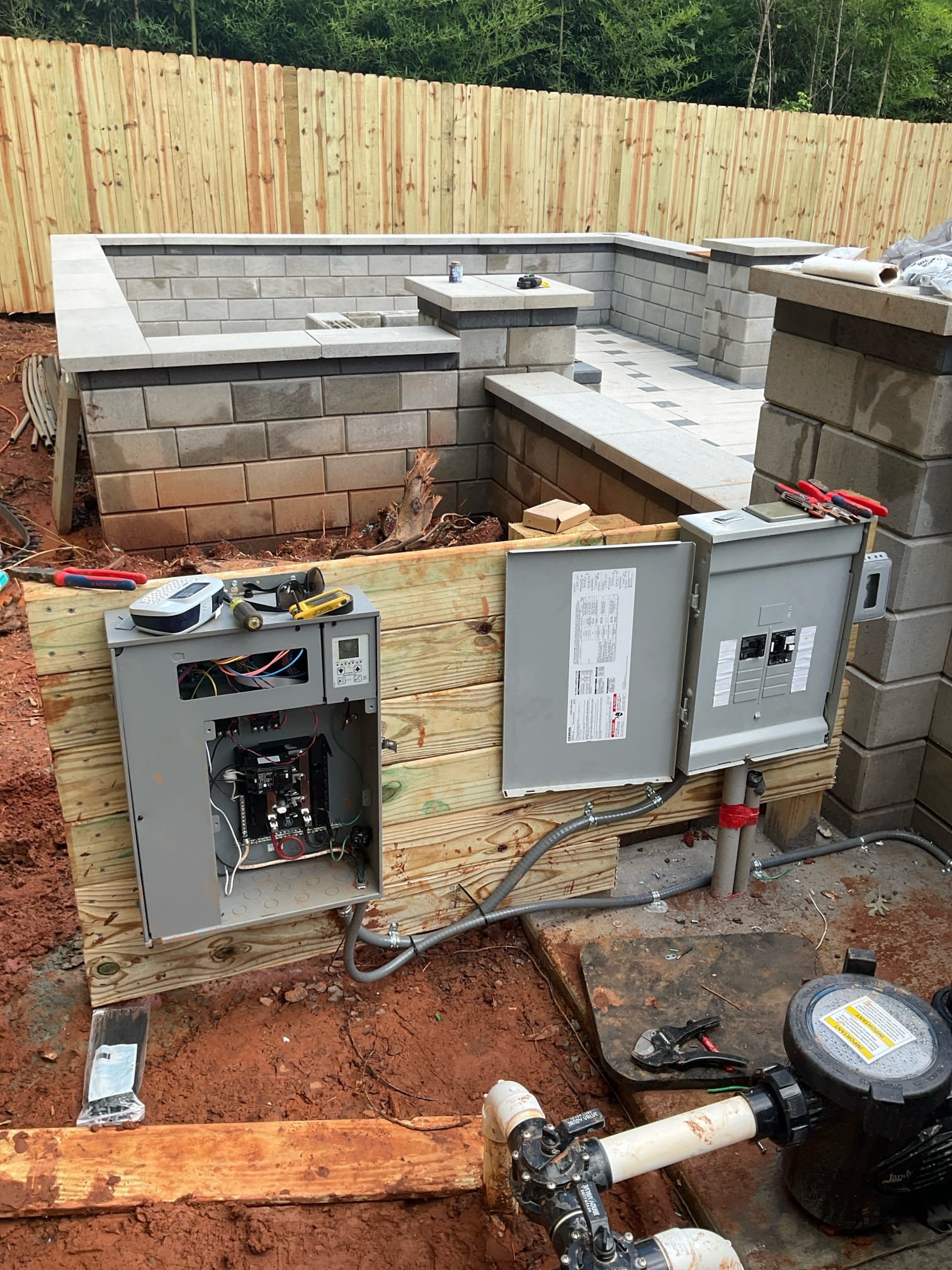 Outdoor service equipment supporting pool electrical work