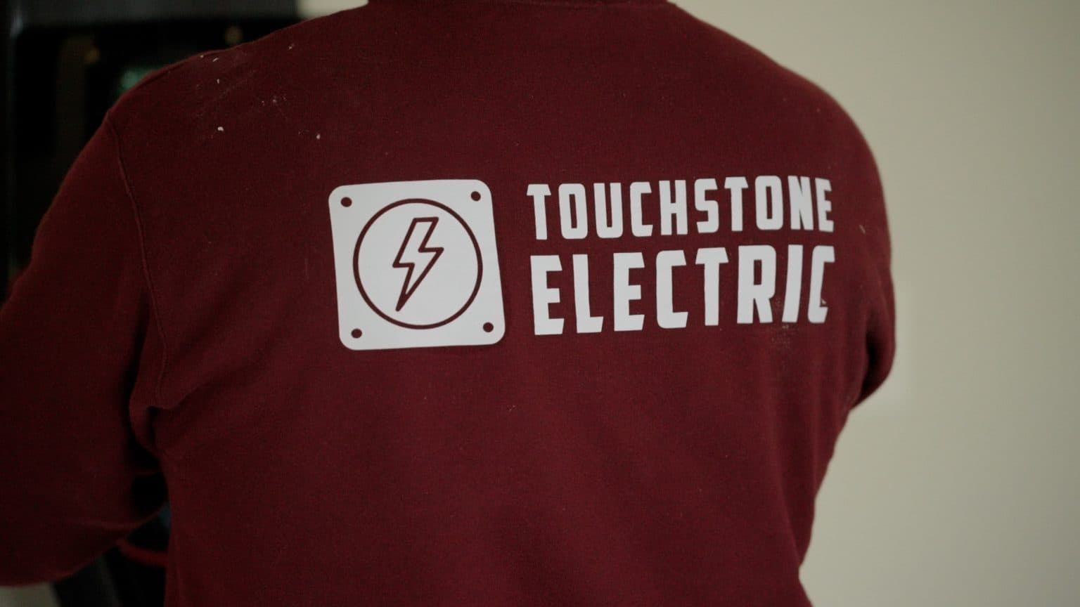 Touchstone Electric technician reviewing electrical plans