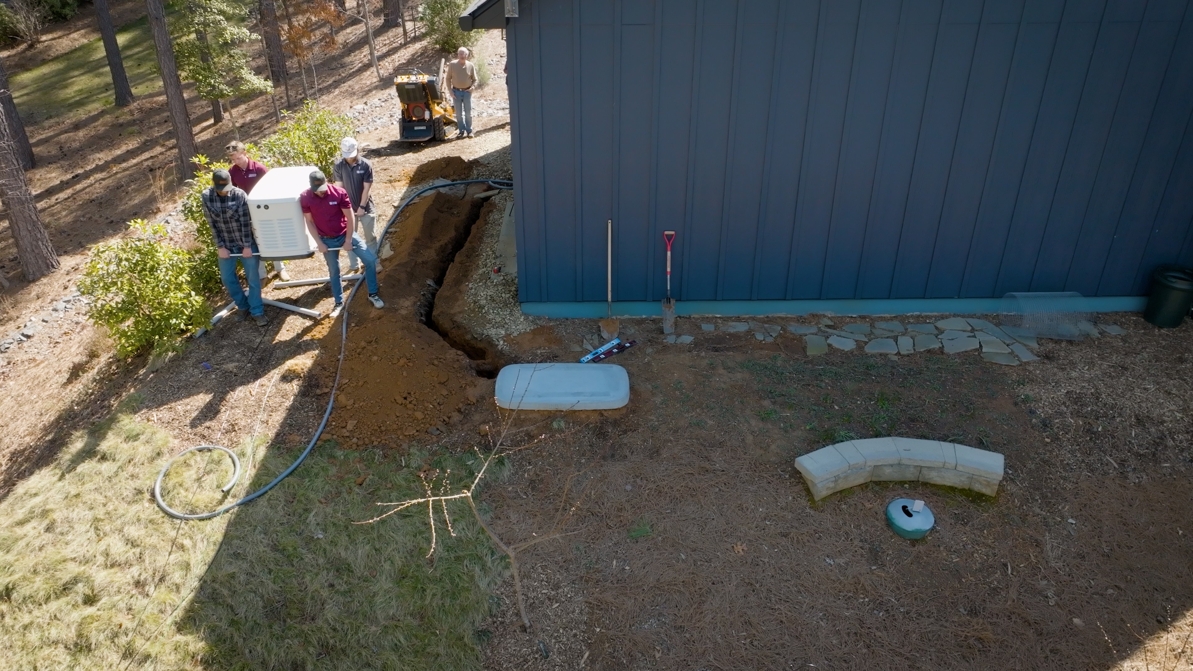 Electrician assessing site for generator installation