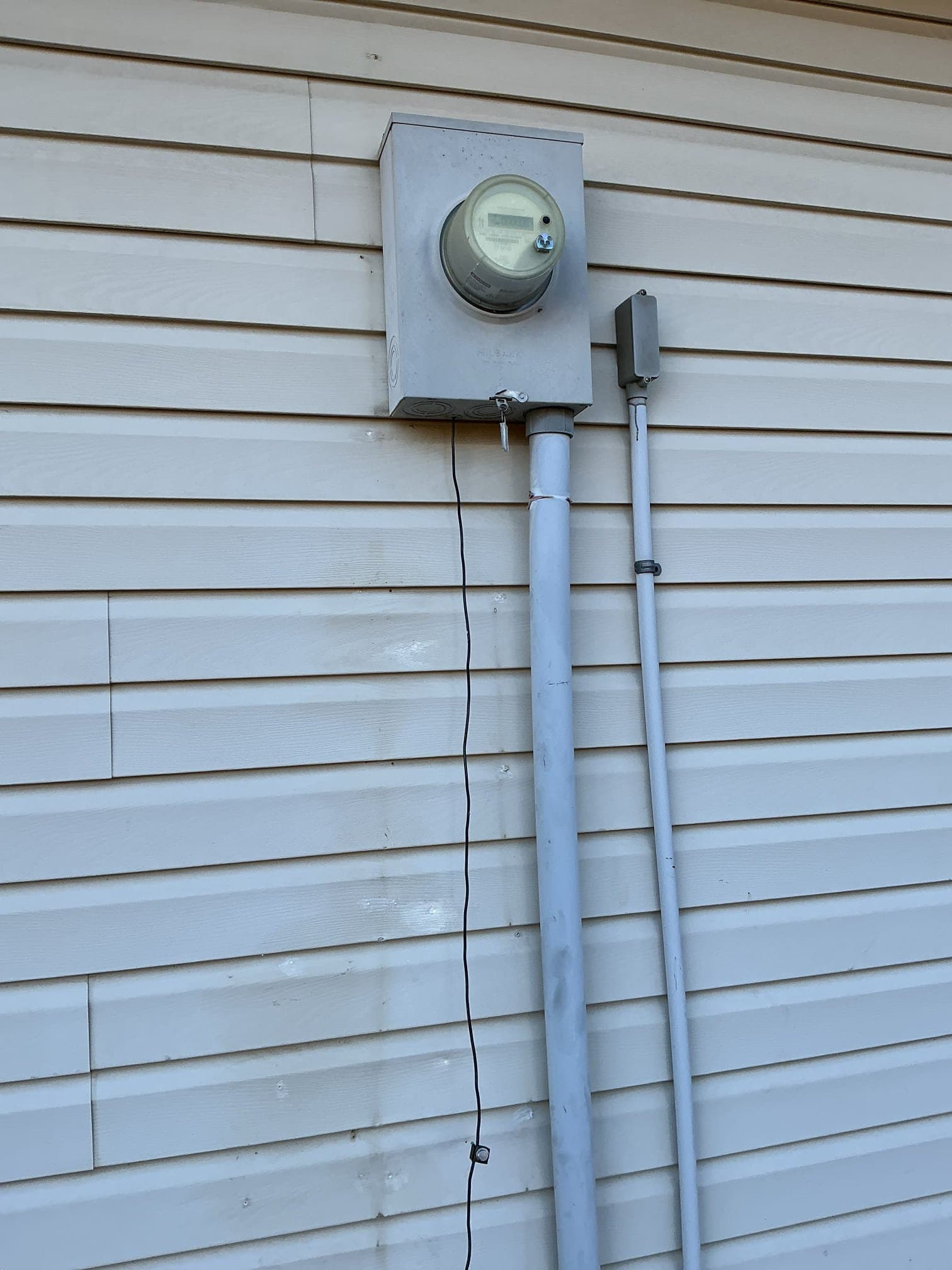 Electrician assessing electrical needs for manual transfer switch