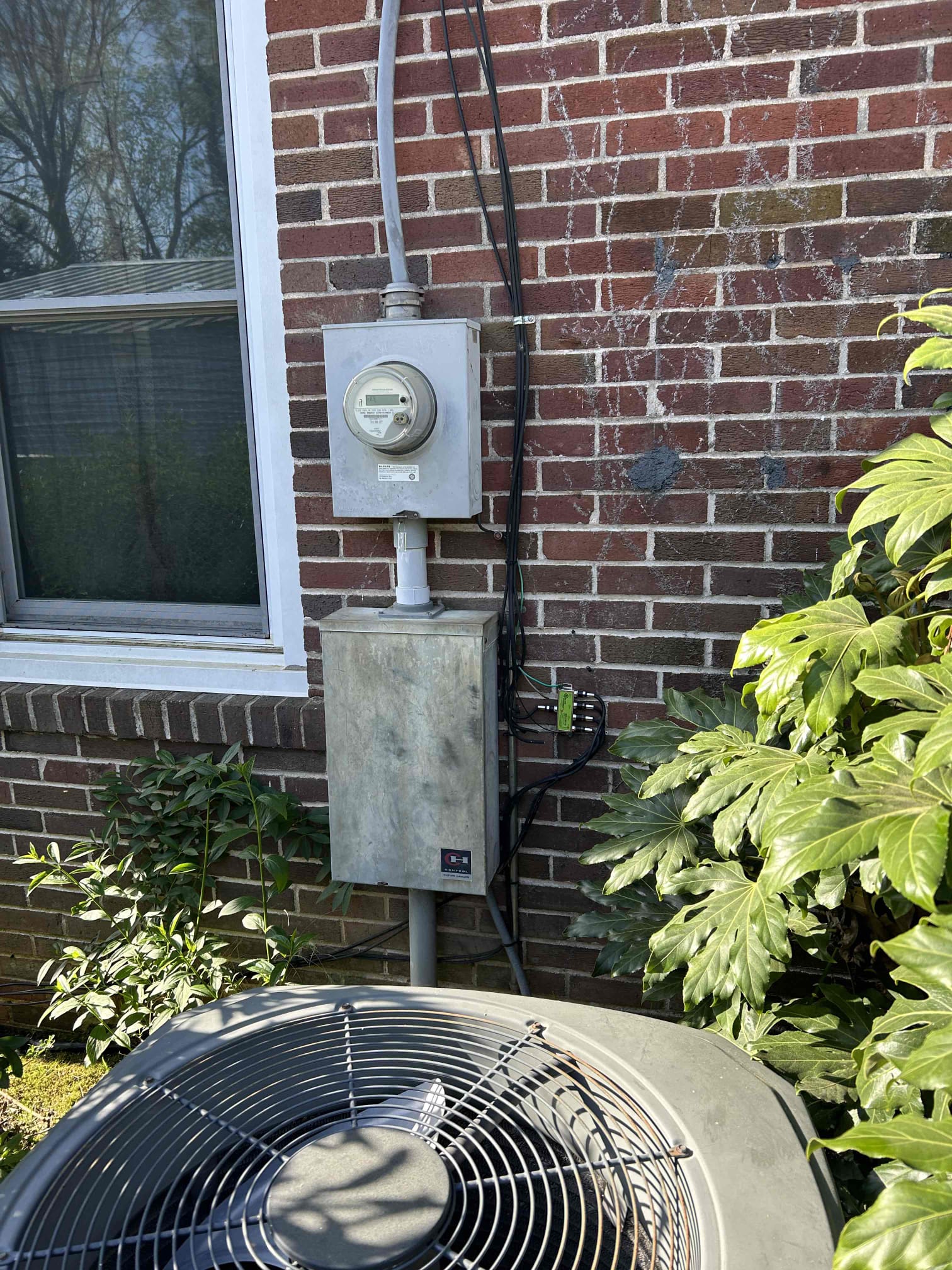 Electrician assessing electrical needs for manual transfer switch