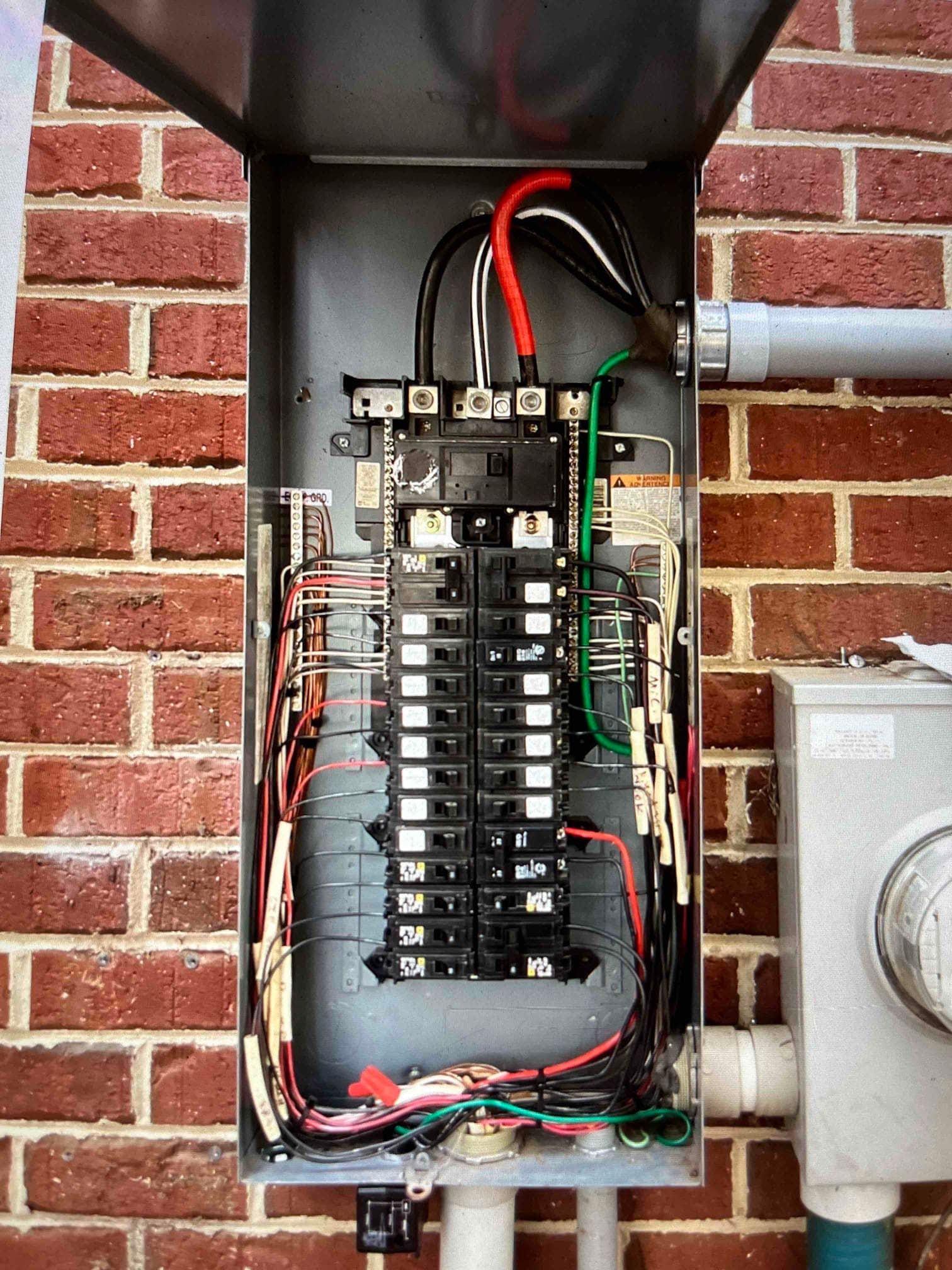 Electrician testing completed whole-home generator installation work