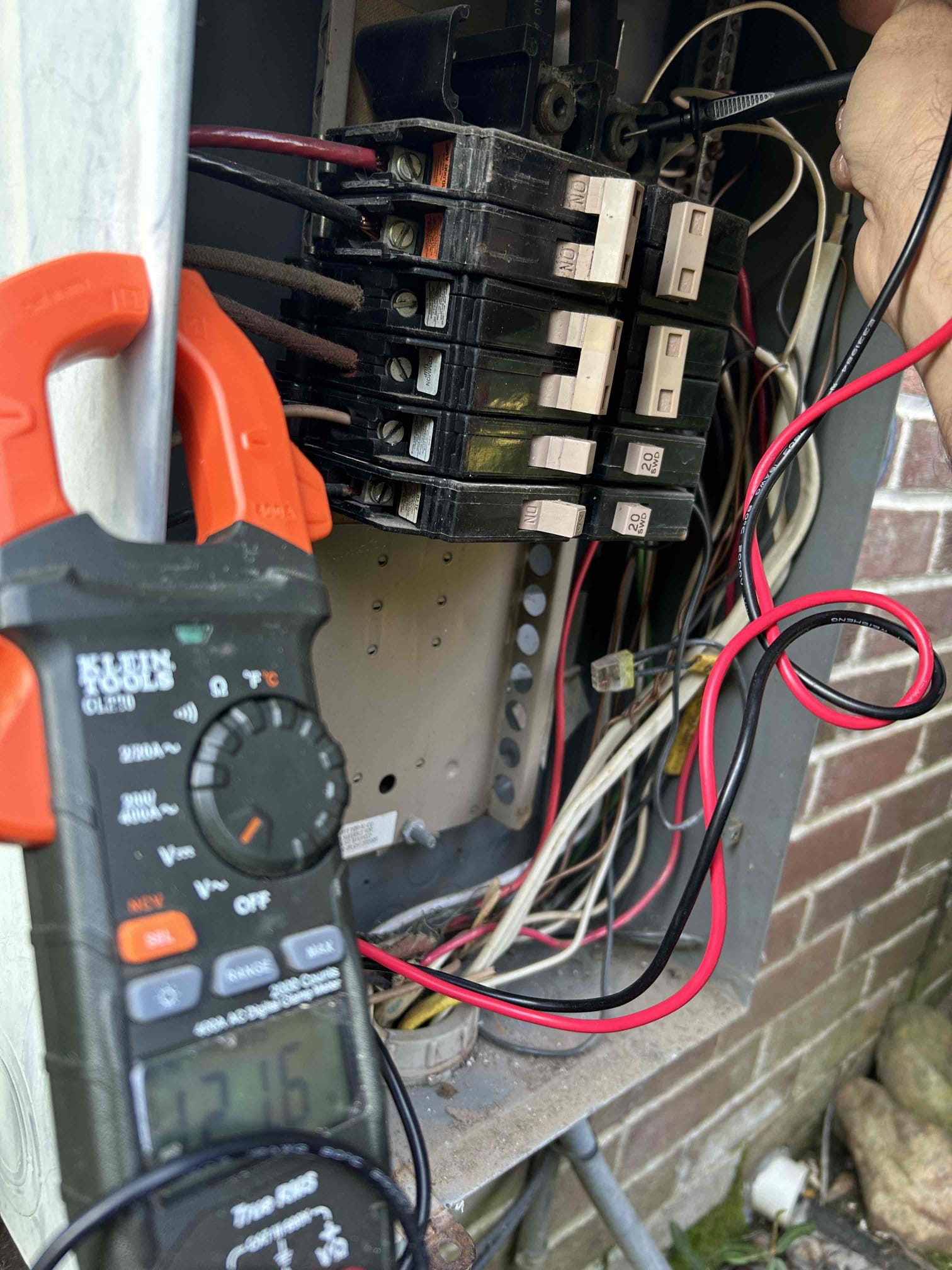 Electrician assessing electrical needs for whole-home generator installation
