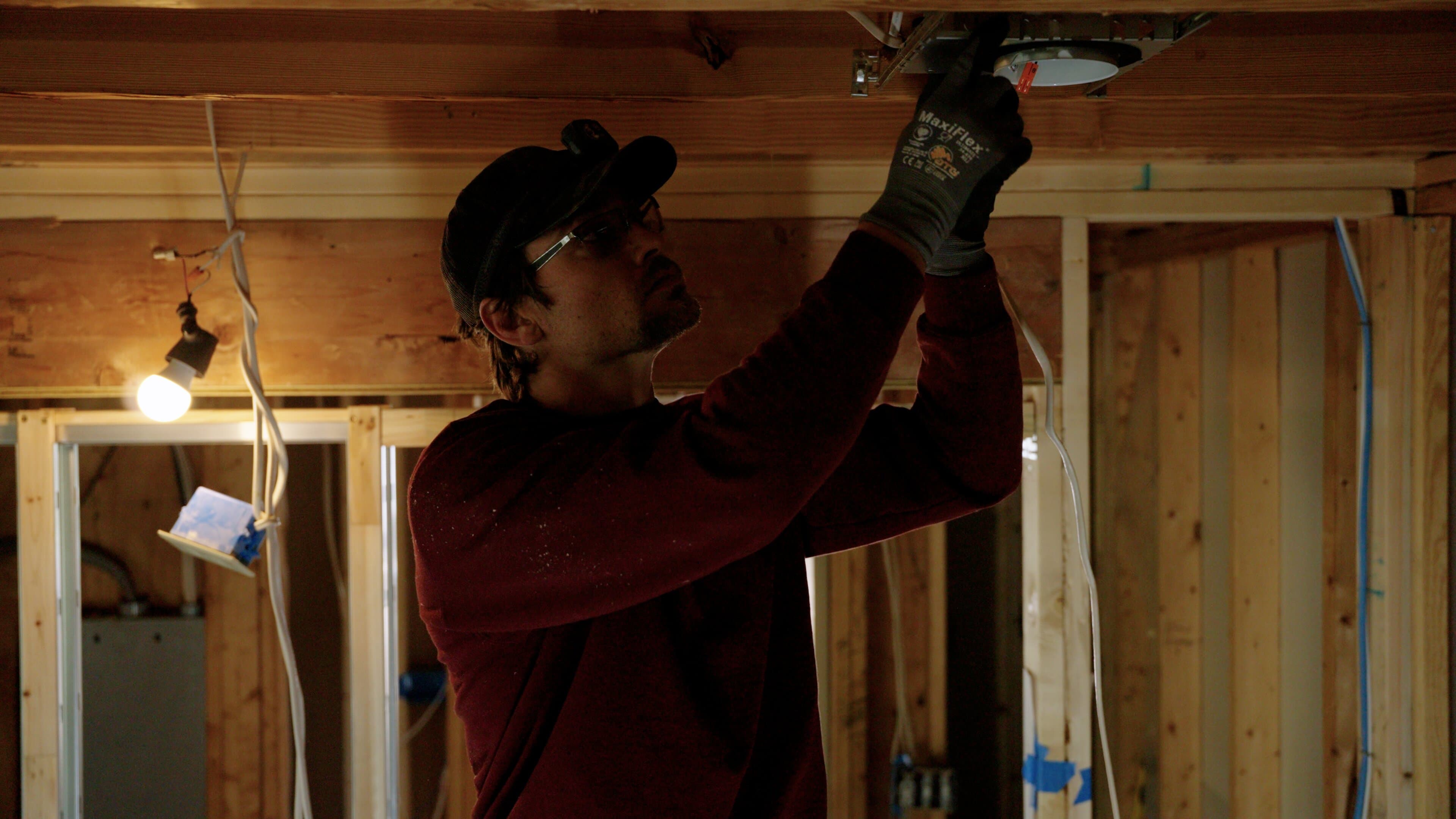 Electrician testing completed whole-home rewiring work