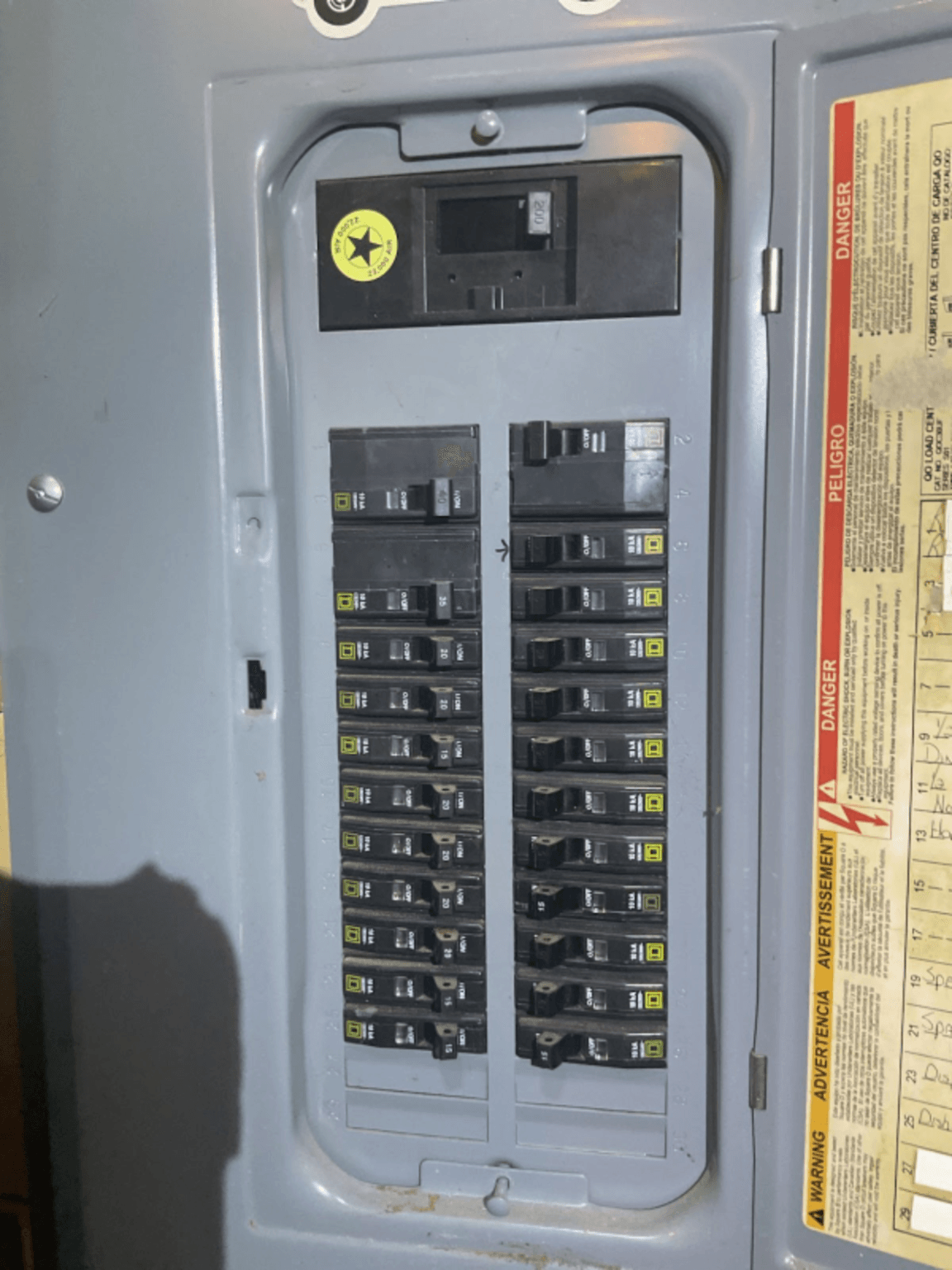 Whole-home surge protection and breaker work inside an electrical panel